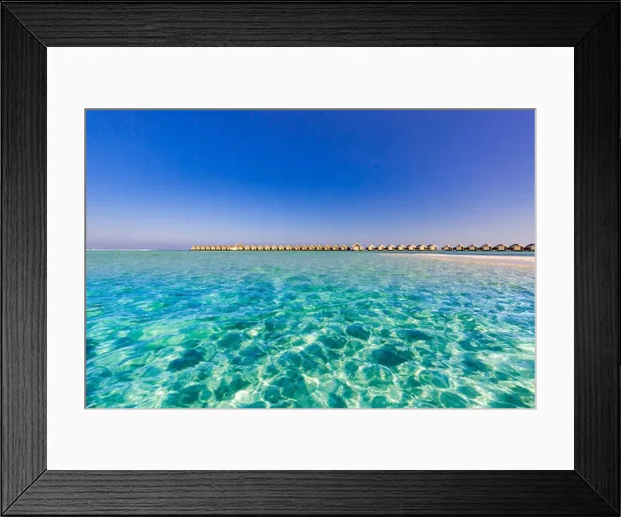 Framed Print : Maldives island beach panorama. Palm trees and beach bar and long wooden pier pathway. Tropical vacation and summer holiday background concept Framed Print : Maldives island beach panorama. Palm trees and beach bar and long wooden pier pathway. Tropical vacation and summer holiday background concept