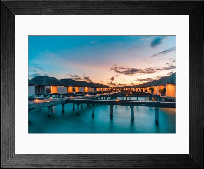 Framed Print : Maldives island and water villas. Island in ocean, overwater villas at the time sunset with led lights and twilight sky. Luxury resort, jetty bungalow Framed Print : Maldives island and water villas. Island in ocean, overwater villas at the time sunset with led lights and twilight sky. Luxury resort, jetty bungalow