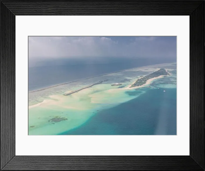 Framed Print : Aerial Maldives island landscape in early morning with resort beach from luxury tropical hotel vacation and holiday Framed Print : Aerial Maldives island landscape in early morning with resort beach from luxury tropical hotel vacation and holiday