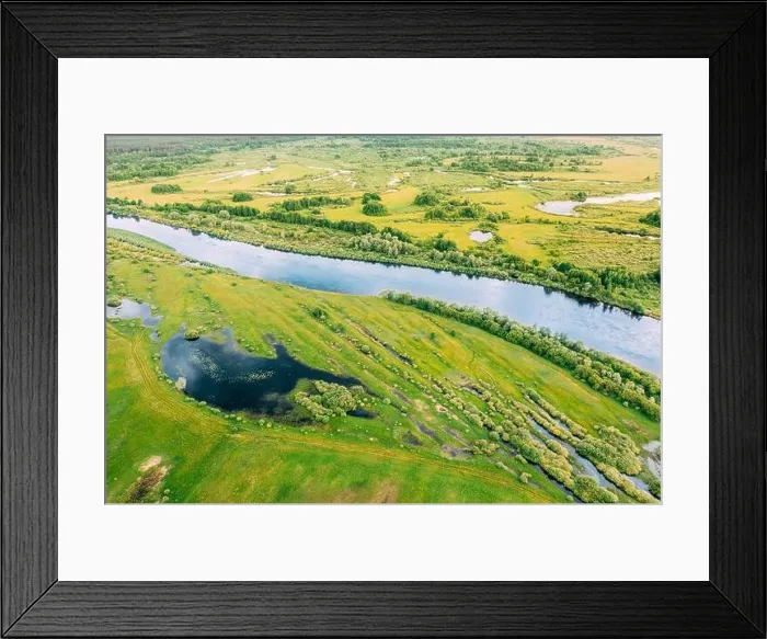 Framed Print : Aerial View. Green Forest, Meadow And River Marsh Landscape In Summer. Top View Of European Nature From High Attitude In Spring. Bird's Eye View Of Framed Print : Aerial View. Green Forest, Meadow And River Marsh Landscape In Summer. Top View Of European Nature From High Attitude In Spring. Bird's Eye View Of