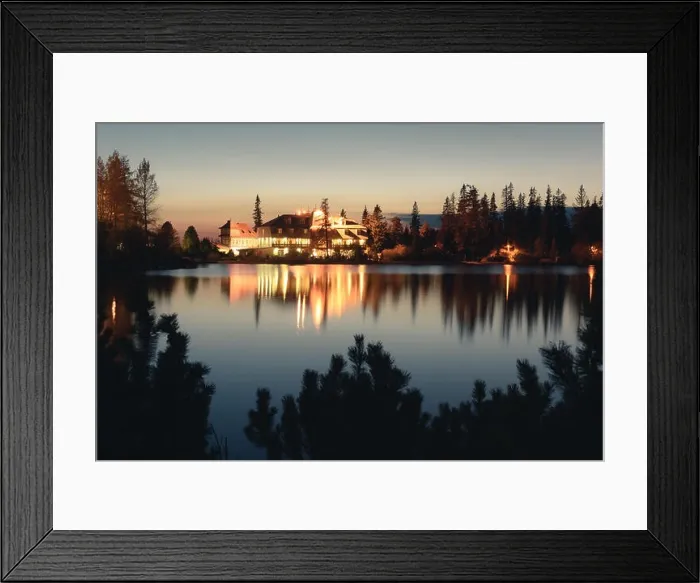 Framed Print : Picturesque autumn view of lake Strbske pleso in High Tatras National Park, Slovakia. Clear water with reflections of illuminated hotels on background Framed Print : Picturesque autumn view of lake Strbske pleso in High Tatras National Park, Slovakia. Clear water with reflections of illuminated hotels on background