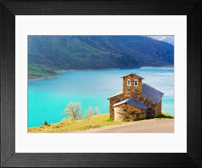 Framed Print : Sunny picturesque view of stone chapel on Roselend lake (Lac de Roselend) in France Alps (Auvergne-Rhone-Alpes). Landscape photography Framed Print : Sunny picturesque view of stone chapel on Roselend lake (Lac de Roselend) in France Alps (Auvergne-Rhone-Alpes). Landscape photography
