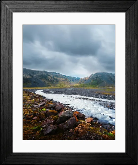 Framed Print : Typical Iceland landscape with river and mountains. Dramatic sky and red stones on a foreground Framed Print : Typical Iceland landscape with river and mountains. Dramatic sky and red stones on a foreground