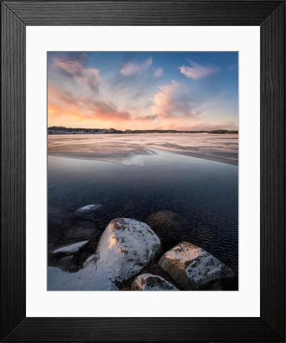 Framed Print : Scenic landscape with sunset and freezing lake at winter evening in FInland Framed Print : Scenic landscape with sunset and freezing lake at winter evening in FInland