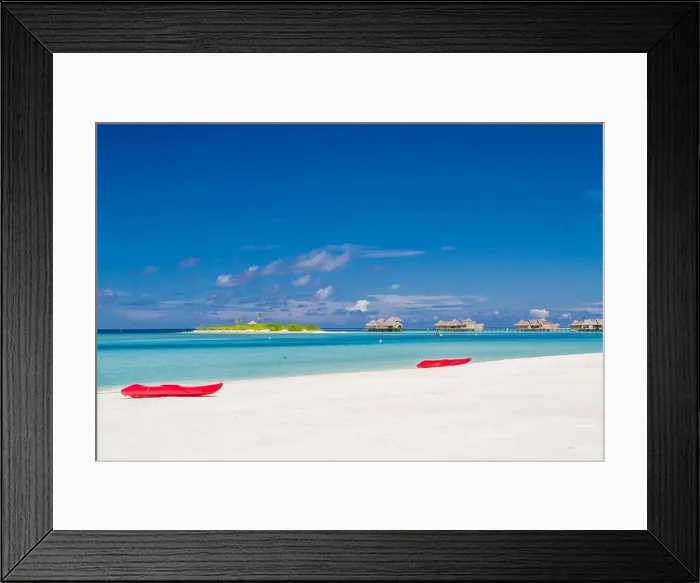 Framed Print : Kayak on sunny tropical beach with palm trees on Maldives. Luxury summer travel vacation, water sport and recreational background Framed Print : Kayak on sunny tropical beach with palm trees on Maldives. Luxury summer travel vacation, water sport and recreational background
