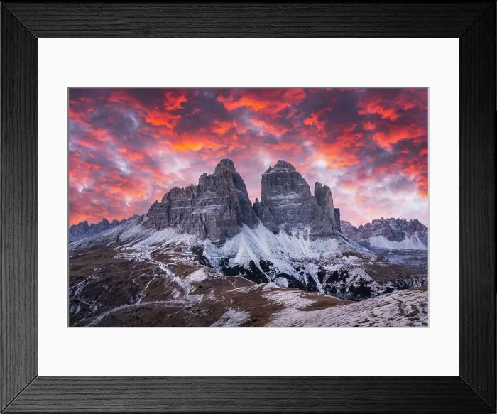 Framed Print : Dramatic evening landscape with Three peaks of Lavaredo mountains, glowing road and pink sunset sky Framed Print : Dramatic evening landscape with Three peaks of Lavaredo mountains, glowing road and pink sunset sky