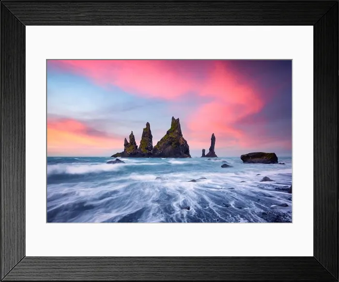 Framed Print : Basalt rock formations Troll toes on black beach with pink sunset clouds. Great purple sky glowing on background. Reynisdrangar, Vik, Iceland Framed Print : Basalt rock formations Troll toes on black beach with pink sunset clouds. Great purple sky glowing on background. Reynisdrangar, Vik, Iceland