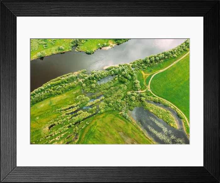 Framed Print : Aerial View Of Green Forest, Meadow And River Marsh Landscape In Summer. Top View Of European Nature From High Attitude In Spring. Bird's Eye View Of Framed Print : Aerial View Of Green Forest, Meadow And River Marsh Landscape In Summer. Top View Of European Nature From High Attitude In Spring. Bird's Eye View Of
