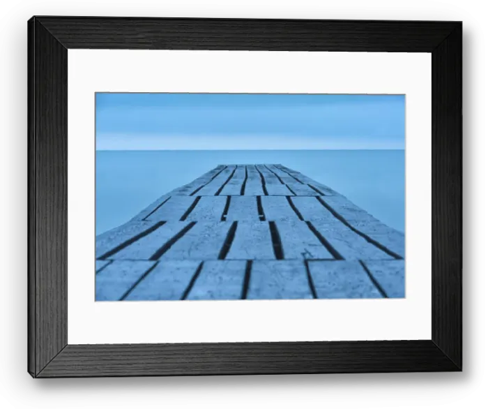 Framed Print : Old and long wooden bridge onto the smooth and empty sea Framed Print : Old and long wooden bridge onto the smooth and empty sea