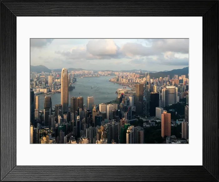 Framed Print : Aerial view of Hong Kong skyline and Victoria Harbor with blue sky in Hong Kong. Asia Framed Print : Aerial view of Hong Kong skyline and Victoria Harbor with blue sky in Hong Kong. Asia