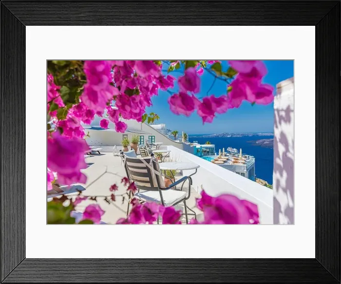 Framed Print : Amazing panoramic landscape, luxury travel vacation. Oia town on Santorini island, Greece. Traditional and famous white architecture and pink flowers Framed Print : Amazing panoramic landscape, luxury travel vacation. Oia town on Santorini island, Greece. Traditional and famous white architecture and pink flowers