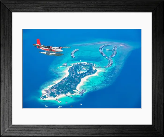 Framed Print : Aerial view of a seaplane approaching island in the Maldives. Maldives beach from birds eye view. Aerial view on Maldives island, atolls and blue sea Framed Print : Aerial view of a seaplane approaching island in the Maldives. Maldives beach from birds eye view. Aerial view on Maldives island, atolls and blue sea