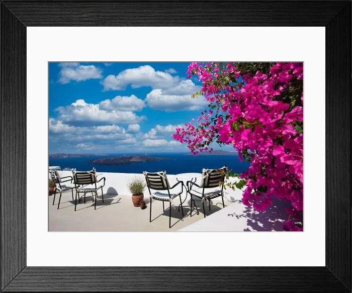 Framed Print : Amazing panoramic landscape, luxury travel vacation. Oia town on Santorini island, Greece. Traditional and famous white architecture and pink flowers Framed Print : Amazing panoramic landscape, luxury travel vacation. Oia town on Santorini island, Greece. Traditional and famous white architecture and pink flowers