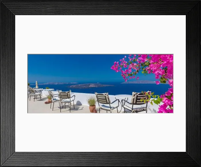 Framed Print : Amazing panoramic landscape, luxury travel vacation. Oia town on Santorini island, Greece. Traditional and famous white architecture and pink flowers Framed Print : Amazing panoramic landscape, luxury travel vacation. Oia town on Santorini island, Greece. Traditional and famous white architecture and pink flowers