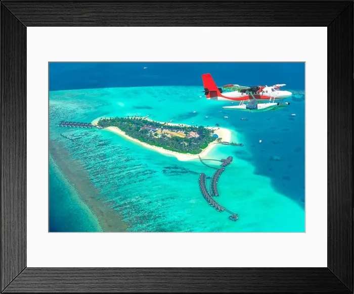 Framed Print : Aerial view of a seaplane approaching island in the Maldives. Maldives beach from birds eye view. Aerial view on Maldives island, atolls and blue sea Framed Print : Aerial view of a seaplane approaching island in the Maldives. Maldives beach from birds eye view. Aerial view on Maldives island, atolls and blue sea