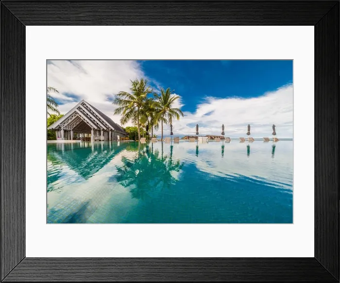 Framed Print : Luxury swimming pool in tropical resort, beach landscape, villa and palm trees. Summer vacation and holiday concept Framed Print : Luxury swimming pool in tropical resort, beach landscape, villa and palm trees. Summer vacation and holiday concept