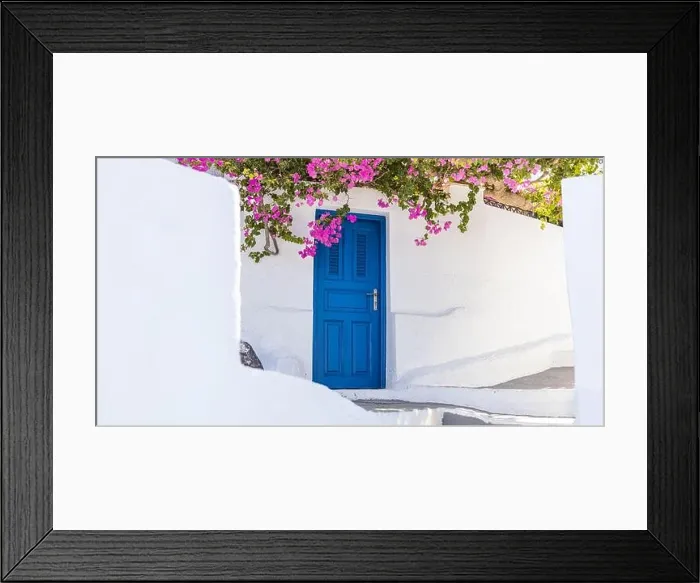 Framed Print : White cycladic architecture blue door and pink bougainvillea flowers on Santorini island, Greece. Fantastic travel background Idyllic summer vacation Framed Print : White cycladic architecture blue door and pink bougainvillea flowers on Santorini island, Greece. Fantastic travel background Idyllic summer vacation
