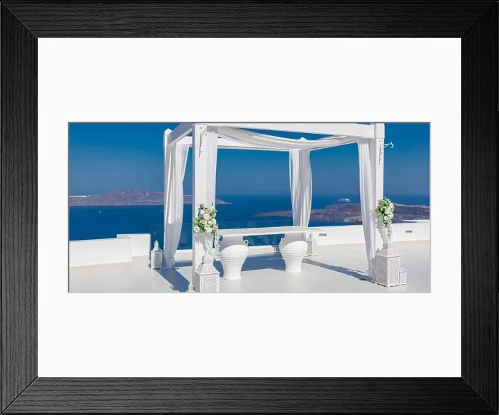 Framed Print : Santorini Island, Greece. Wedding decoration on a popular couple destination. Elegant wedding arch with white flowers, vases on background of blue sea Framed Print : Santorini Island, Greece. Wedding decoration on a popular couple destination. Elegant wedding arch with white flowers, vases on background of blue sea