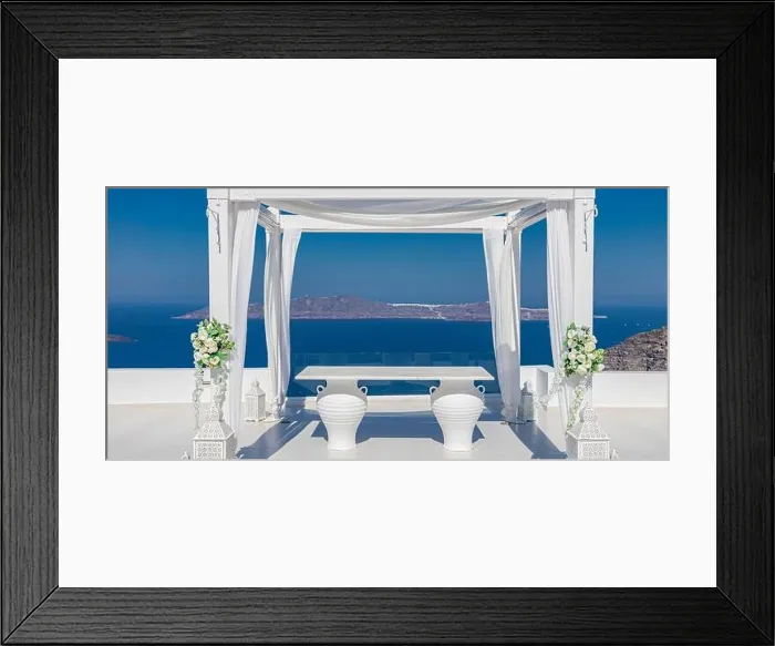 Framed Print : Santorini Island, Greece. Wedding decoration on a popular couple destination. Elegant wedding arch with white flowers, vases on background of blue sea Framed Print : Santorini Island, Greece. Wedding decoration on a popular couple destination. Elegant wedding arch with white flowers, vases on background of blue sea