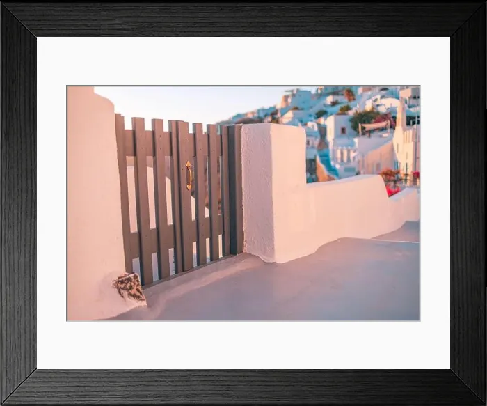 Framed Print : Santorini island sunset view. Architectural details, famous travel destination abstract closeup view of streets in warm sunset light. Wooden gate door Framed Print : Santorini island sunset view. Architectural details, famous travel destination abstract closeup view of streets in warm sunset light. Wooden gate door