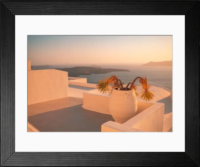 Framed Print : Santorini island sunset view. Architectural details, famous travel destination, abstract closeup view of streets in warm sunset light. Palm plants Framed Print : Santorini island sunset view. Architectural details, famous travel destination, abstract closeup view of streets in warm sunset light. Palm plants