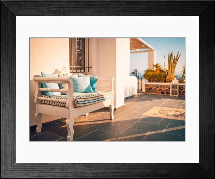 Framed Print : Santorini island, Greece sunset view. Architectural details, famous travel destination, abstract closeup view warm sunset light. Relaxing terrace Framed Print : Santorini island, Greece sunset view. Architectural details, famous travel destination, abstract closeup view warm sunset light. Relaxing terrace