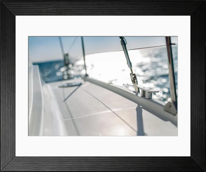 Framed Print : Sailing at sunset. A view from the yacht's deck to the bow and sails Framed Print : Sailing at sunset. A view from the yacht's deck to the bow and sails