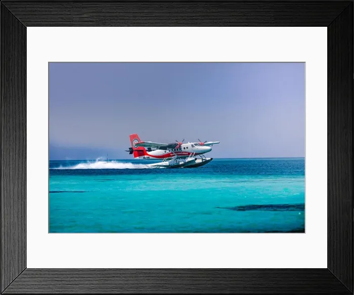 Framed Print : Red and white seaplane approaching island in the Maldives. Transmaldivian airlines in Maldives island Framed Print : Red and white seaplane approaching island in the Maldives. Transmaldivian airlines in Maldives island