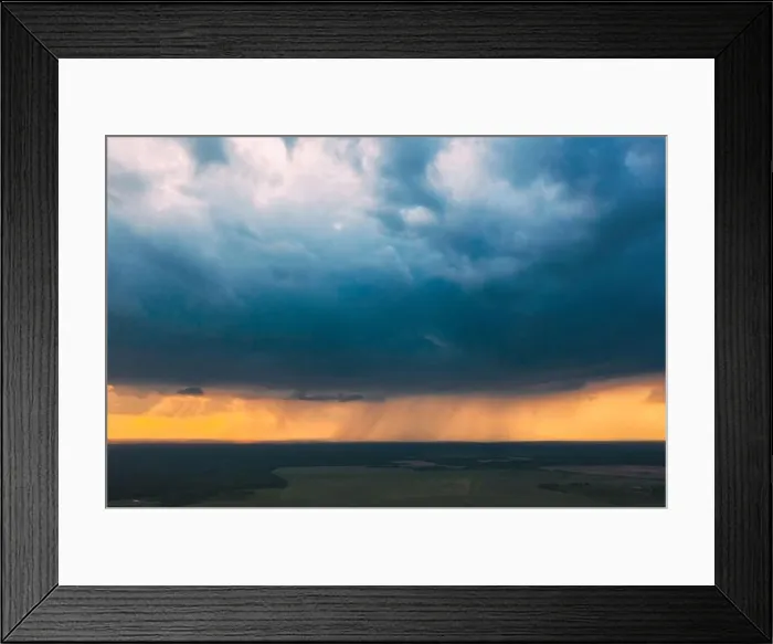 Framed Print : Aerial View. Sunset Sky Above Green Forest, Meadow And Fields Landscape In Sunny Evening. Top View Of European Nature From High Attitude In Summer Framed Print : Aerial View. Sunset Sky Above Green Forest, Meadow And Fields Landscape In Sunny Evening. Top View Of European Nature From High Attitude In Summer