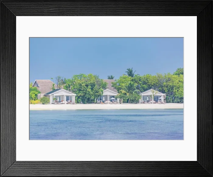 Framed Print : Beautiful tropical Maldives resort hotel and island with beach and sea on sky for holiday vacation background concept - Boost up color Processing
