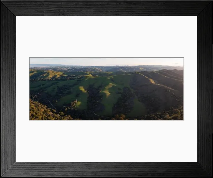 Framed Print : Early morning light shines on the rolling hills in the East Bay region near San Francisco Bay, California. This area turns green during winter months