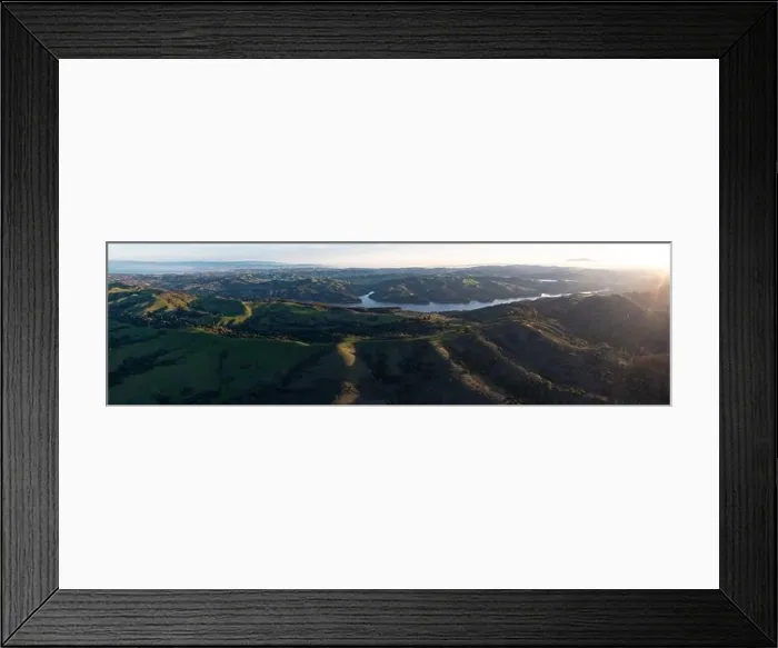 Framed Print : Early morning sunlight shines on the green hills of the east bay, near San Francisco Bay. These hills in California turn green during winter months Framed Print : Early morning sunlight shines on the green hills of the east bay, near San Francisco Bay. These hills in California turn green during winter months