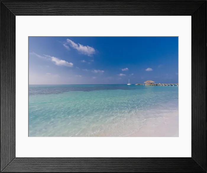 Framed Print : Beautiful Maldives island beach landscape. Luxury resort with chairs and umbrella for summer vacation and holiday background. Exotic tropical beach Framed Print : Beautiful Maldives island beach landscape. Luxury resort with chairs and umbrella for summer vacation and holiday background. Exotic tropical beach