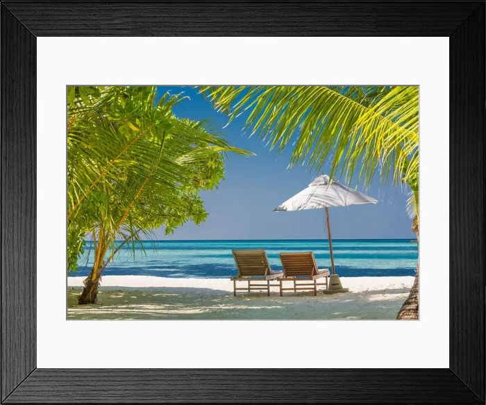 Framed Print : Two beach chairs on white sand under palm tree leaves. Perfect beach landscape, tropical banner for romantic getaway and vacation background Framed Print : Two beach chairs on white sand under palm tree leaves. Perfect beach landscape, tropical banner for romantic getaway and vacation background