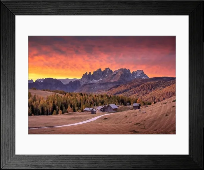 Framed Print : Incredible red sunset at Fuchiade valley in Italian Dolomites countryside. Wooden huts, orange larches forest Framed Print : Incredible red sunset at Fuchiade valley in Italian Dolomites countryside. Wooden huts, orange larches forest