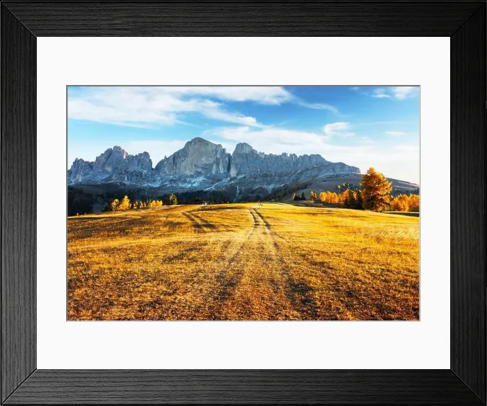 Framed Print : Beautiful rural Italian landscape with autumn meadow, wooden house and peaks of high mountains in the background Framed Print : Beautiful rural Italian landscape with autumn meadow, wooden house and peaks of high mountains in the background