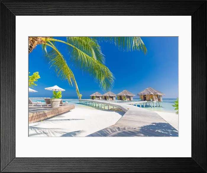 Framed Print : Tropical beach in Maldives with palm trees and blue lagoon, wooden jetty. Luxury vacation and holiday background, loungers, beach chairs and umbrella Framed Print : Tropical beach in Maldives with palm trees and blue lagoon, wooden jetty. Luxury vacation and holiday background, loungers, beach chairs and umbrella