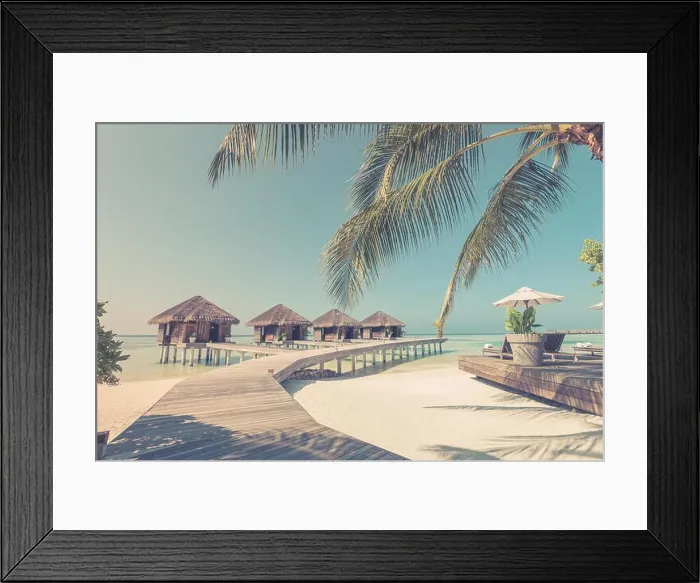 Framed Print : Tropical beach in Maldives with palm trees and blue lagoon, wooden jetty. Luxury vacation and holiday background, loungers, beach chairs and umbrella Framed Print : Tropical beach in Maldives with palm trees and blue lagoon, wooden jetty. Luxury vacation and holiday background, loungers, beach chairs and umbrella