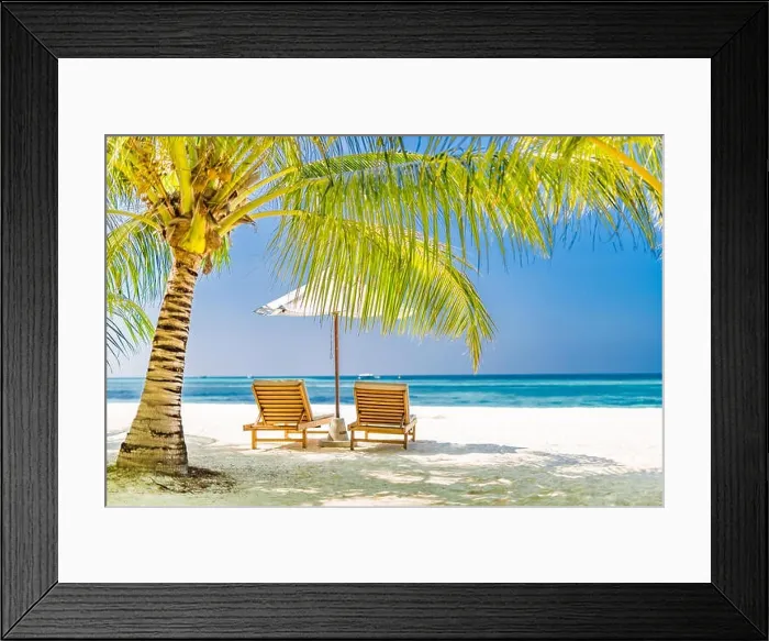Framed Print : Two beach chairs on white sand under palm tree leaves. Perfect beach landscape, tropical banner for romantic getaway and vacation background Framed Print : Two beach chairs on white sand under palm tree leaves. Perfect beach landscape, tropical banner for romantic getaway and vacation background