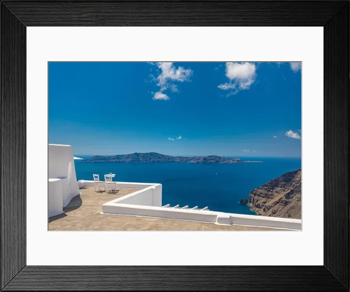 Framed Print : Two chairs on the terrace with sea views. Santorini island, Greece. Travel and vacation background. Luxury summer landscape Framed Print : Two chairs on the terrace with sea views. Santorini island, Greece. Travel and vacation background. Luxury summer landscape