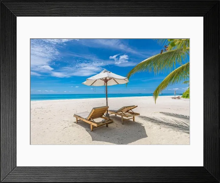 Framed Print : Beach umbrella and chairs for summer couple vacation, holiday, honeymoon travel destination. Luxury beach landscape sea view. Tropical island resort Framed Print : Beach umbrella and chairs for summer couple vacation, holiday, honeymoon travel destination. Luxury beach landscape sea view. Tropical island resort