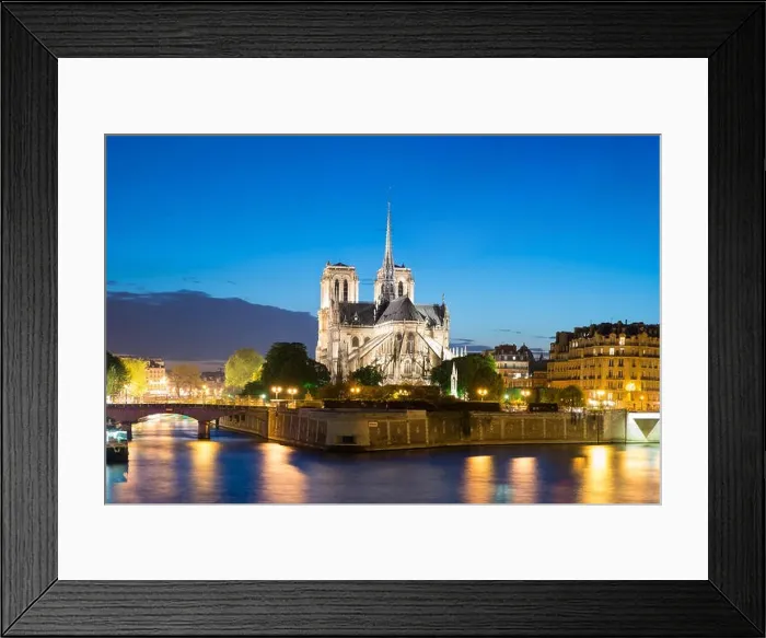Framed Print : Notre Dame de Paris with cruise ship on Seine river at night in Paris, France Framed Print : Notre Dame de Paris with cruise ship on Seine river at night in Paris, France