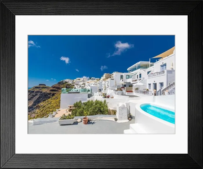 Framed Print : Beautiful panoramic view of picturesque town in Santorini, caldera and volcano on the Mediterranean Sea. Traditional white architecture holiday island