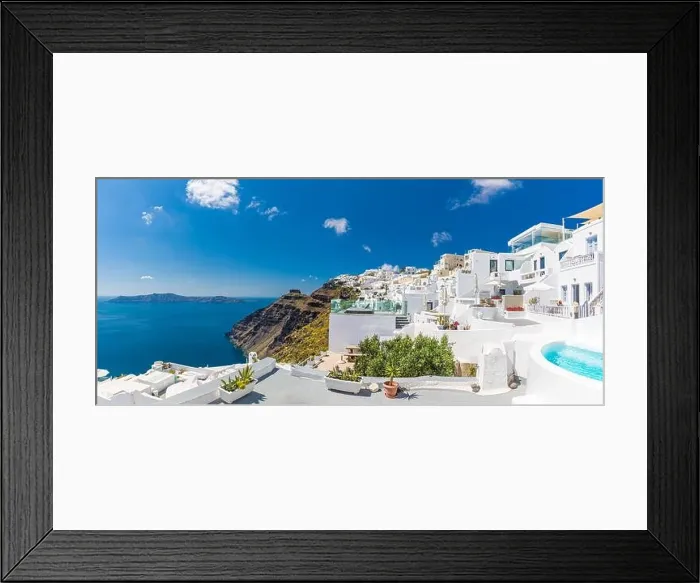 Framed Print : Beautiful panoramic view of picturesque town in Santorini, caldera and volcano on the Mediterranean Sea. Traditional white architecture holiday island Framed Print : Beautiful panoramic view of picturesque town in Santorini, caldera and volcano on the Mediterranean Sea. Traditional white architecture holiday island
