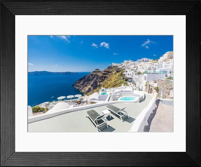 Framed Print : Beautiful panoramic view of picturesque town in Santorini, caldera and volcano on the Mediterranean Sea. Traditional white architecture holiday island Framed Print : Beautiful panoramic view of picturesque town in Santorini, caldera and volcano on the Mediterranean Sea. Traditional white architecture holiday island