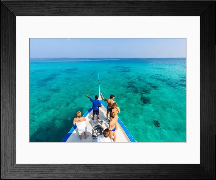 Framed Print : Perfect summer holiday concept in Maldives island. Dhoni boat in blue sea heading over tropical beach, white sand, palm trees, luxury travel banner Framed Print : Perfect summer holiday concept in Maldives island. Dhoni boat in blue sea heading over tropical beach, white sand, palm trees, luxury travel banner