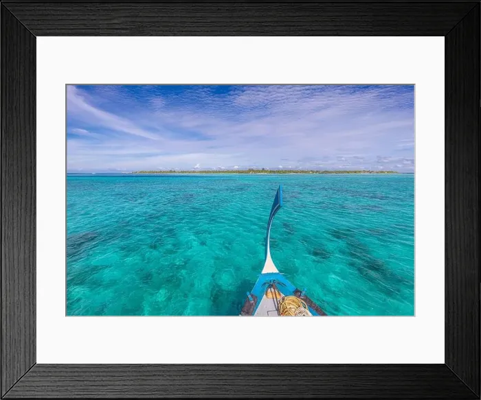 Framed Print : Traditional Maldivian boat Dhoni with amazing tropical island background view. Nature paradise beach, open sea view, seascape in Maldives, luxury Framed Print : Traditional Maldivian boat Dhoni with amazing tropical island background view. Nature paradise beach, open sea view, seascape in Maldives, luxury