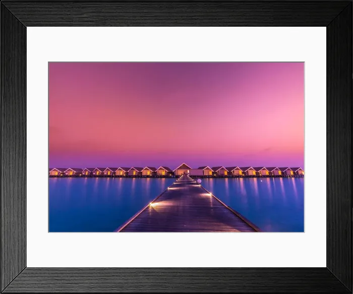 Framed Print : Sunset on Maldives island, luxury water villas resort and wooden pier. Beautiful sky and clouds and beach background for summer vacation holiday Framed Print : Sunset on Maldives island, luxury water villas resort and wooden pier. Beautiful sky and clouds and beach background for summer vacation holiday