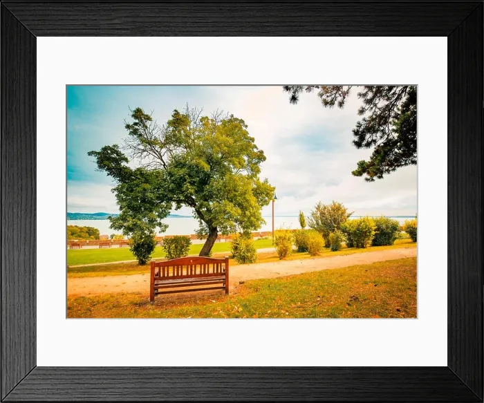 Framed Print : Lakeside bench at october indian summer, overcast sky, tranquil nature, mountain view background Framed Print : Lakeside bench at october indian summer, overcast sky, tranquil nature, mountain view background