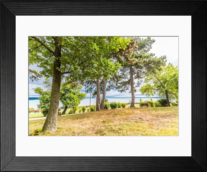 Framed Print : Lakeside bench at october indian summer, overcast sky, tranquil nature, mountain view background Framed Print : Lakeside bench at october indian summer, overcast sky, tranquil nature, mountain view background